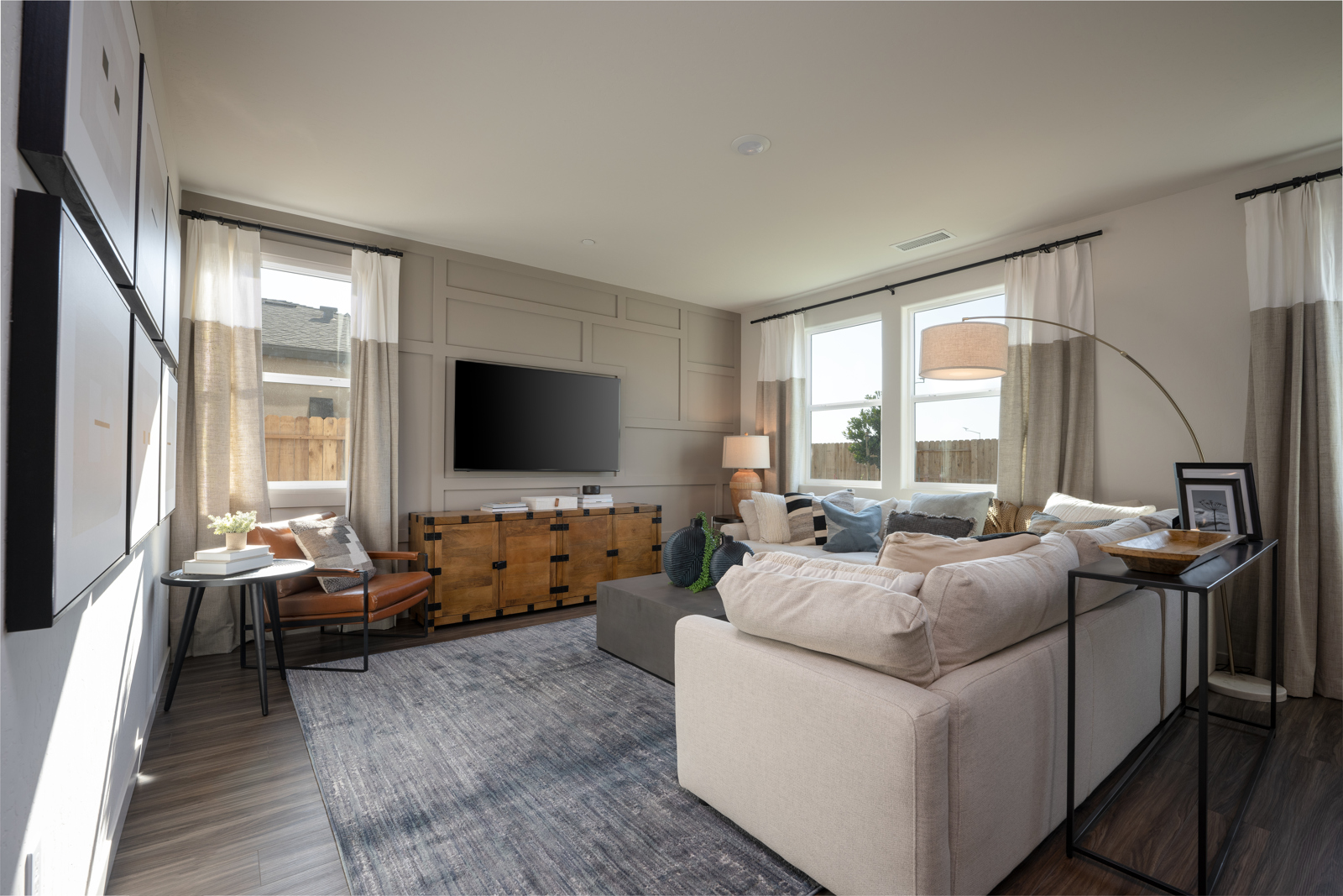 A living room with a tv and couches.