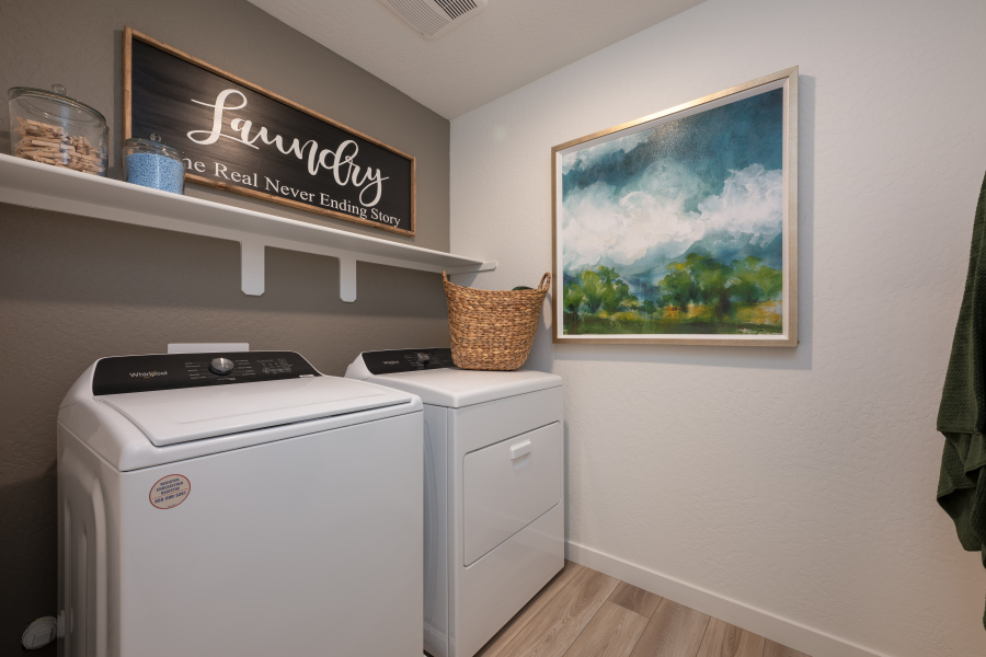 A laundry room with a washer and dryer.