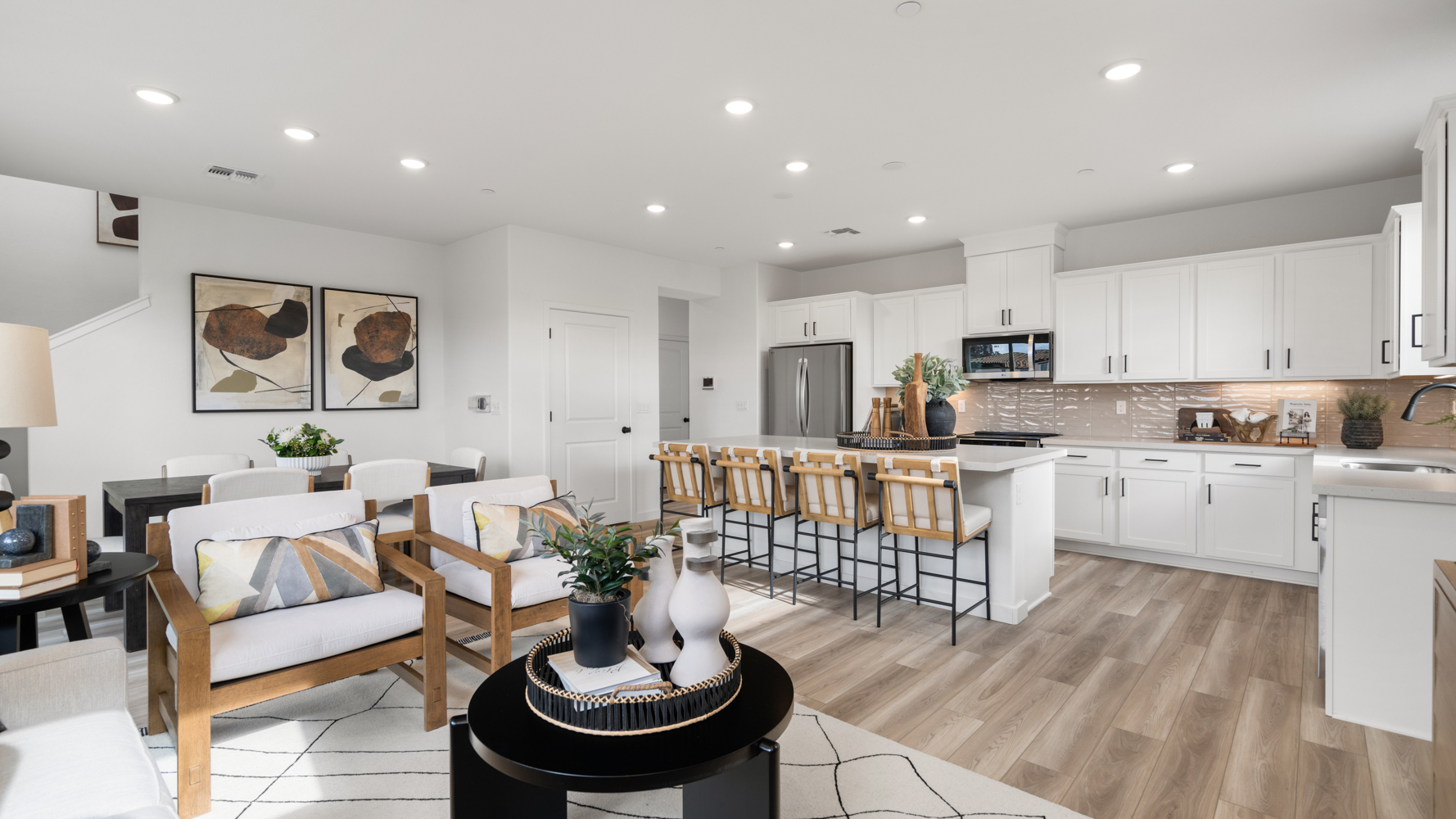 A large kitchen with white cabinets.