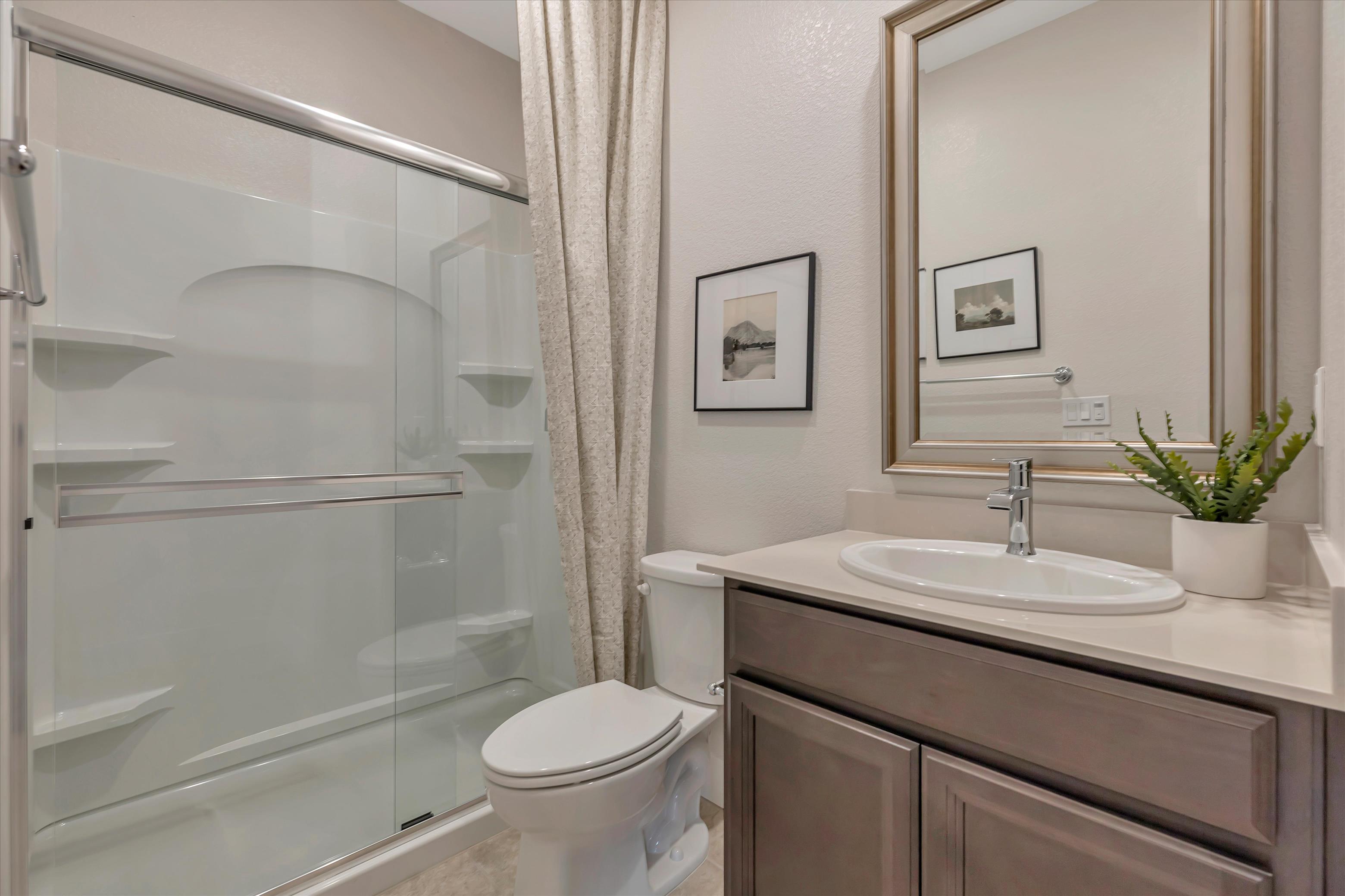 A bathroom with a glass shower.