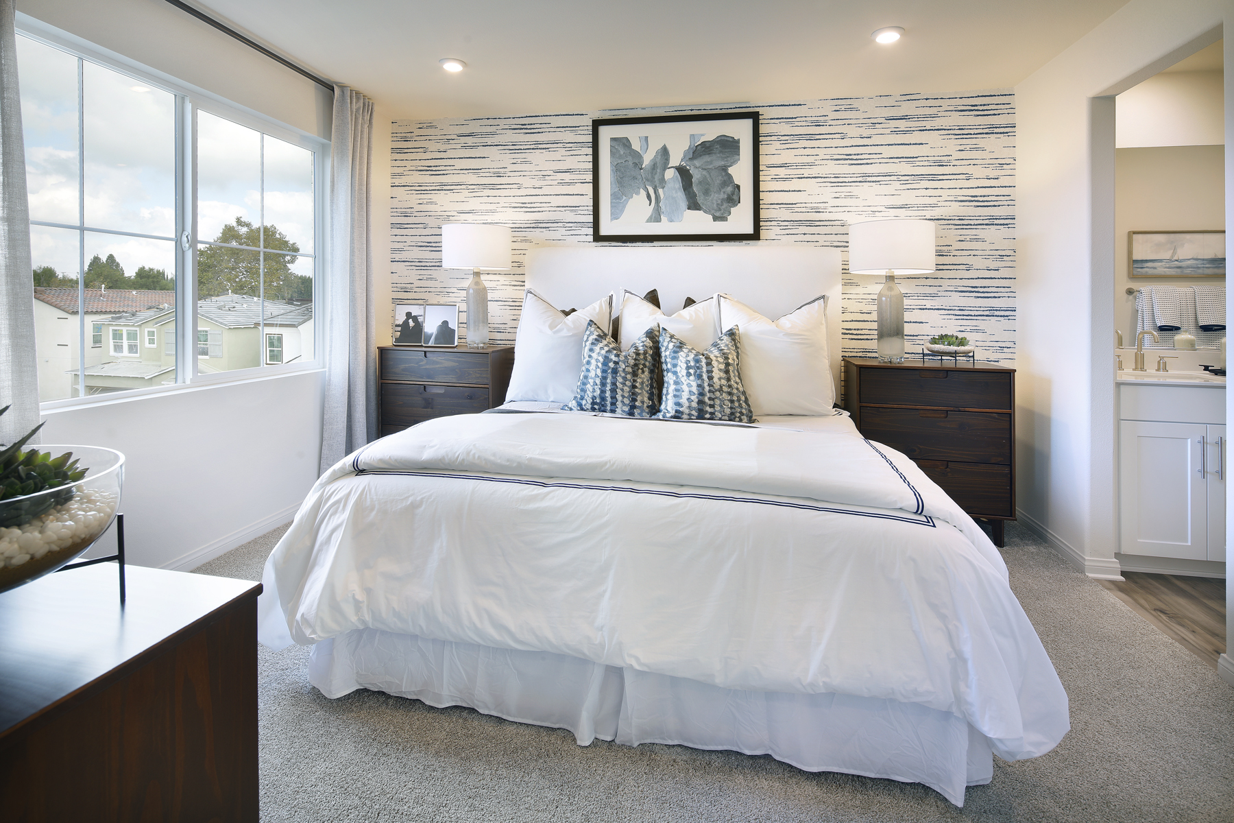 A bedroom with a large bed.