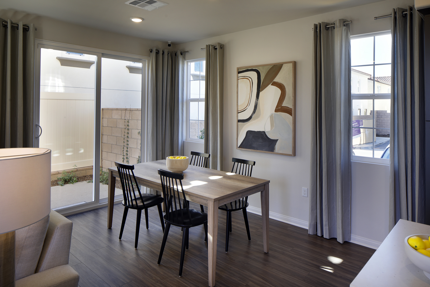 A dining room with a large window.