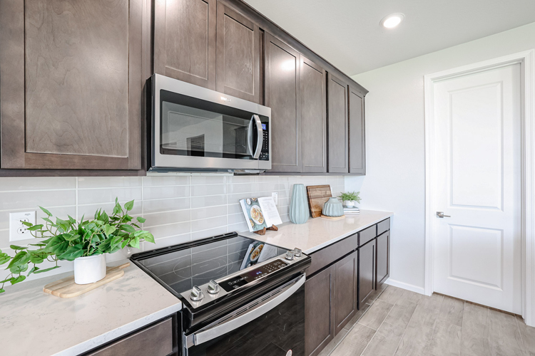 A kitchen with black appliances.