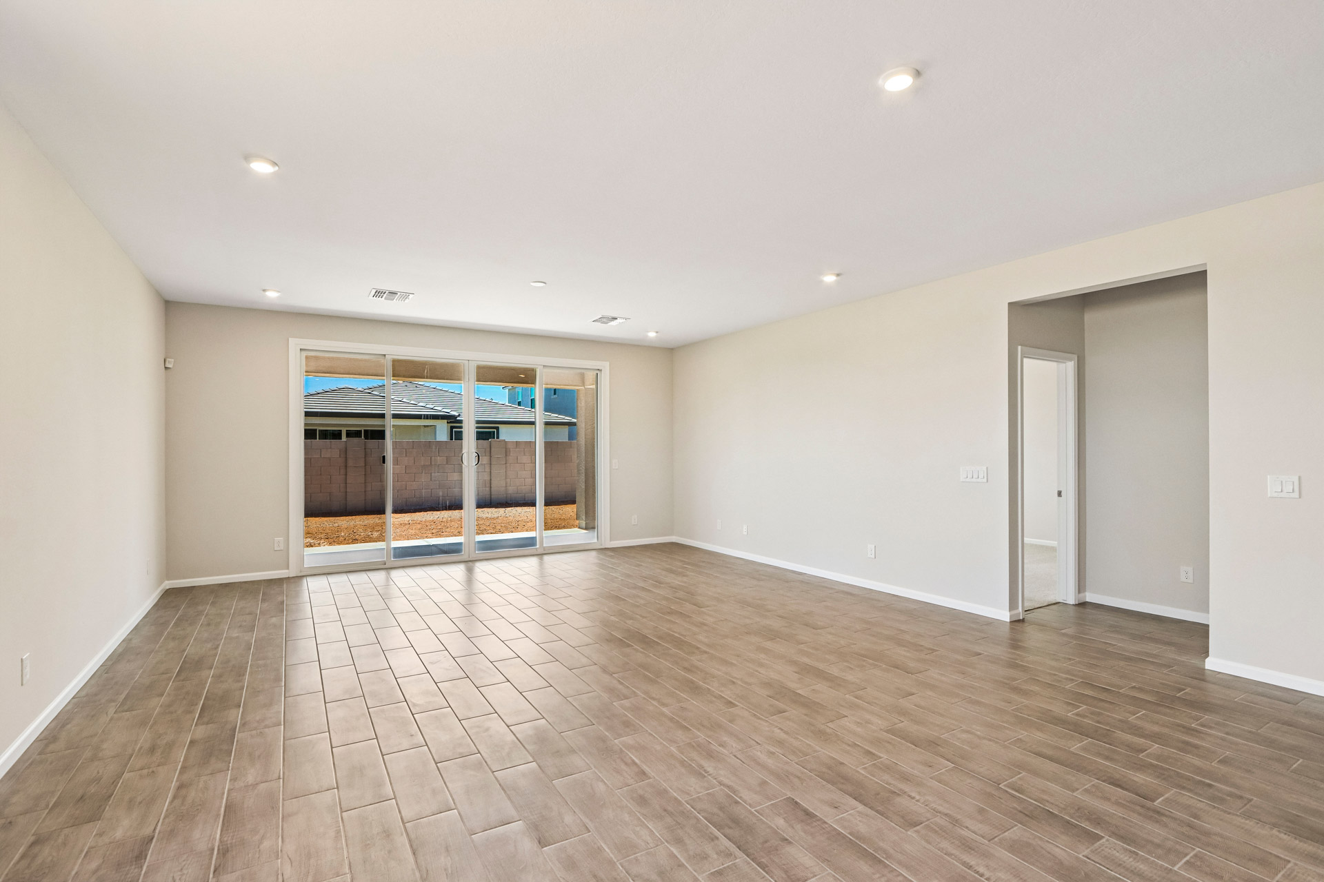 A room with a wood floor and a wood floor.
