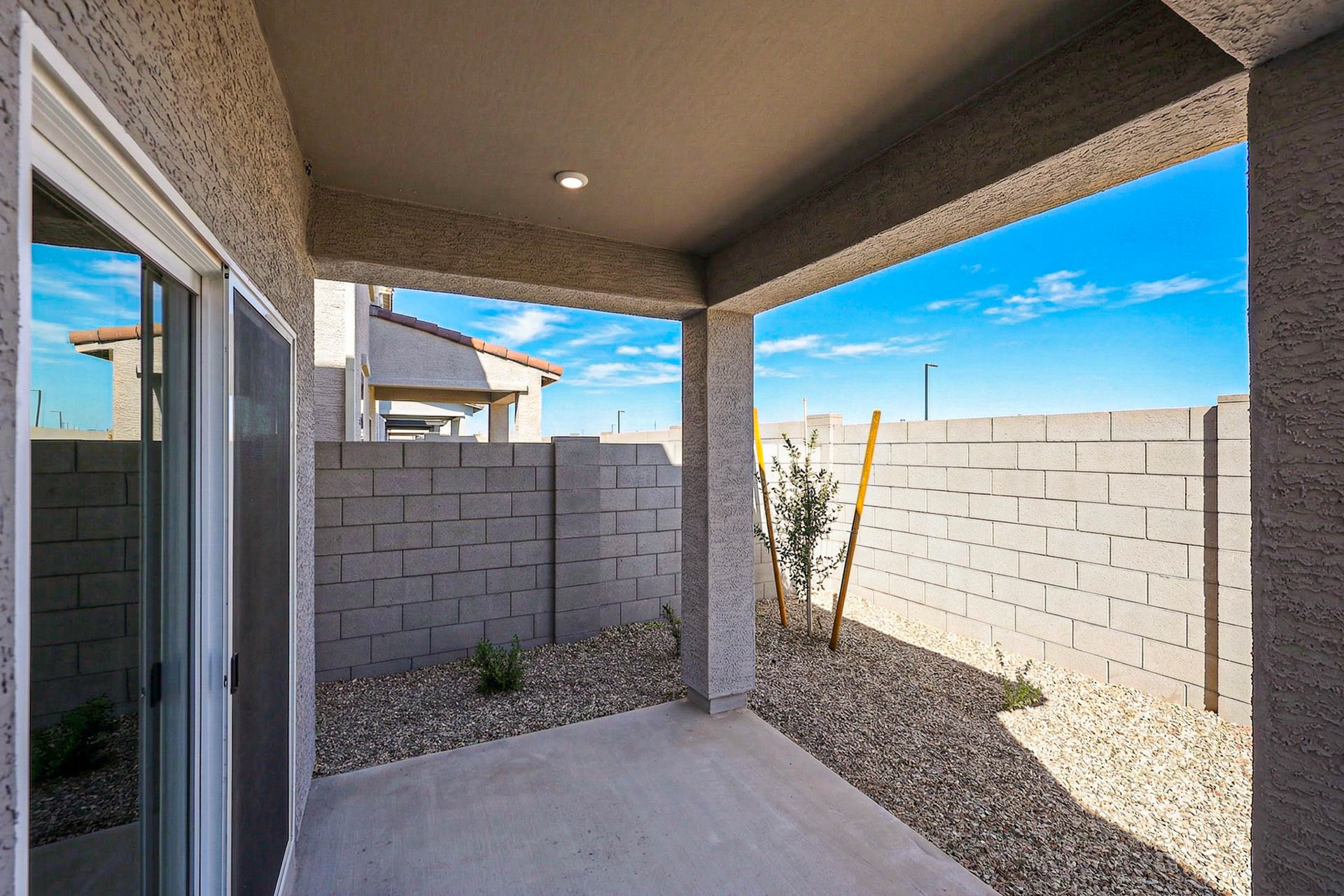 A house with a stone patio.