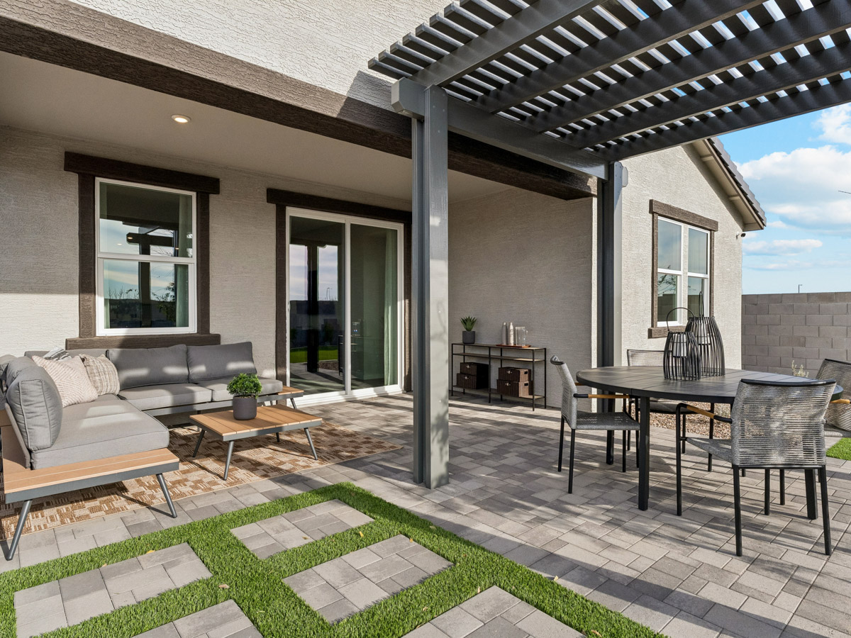A patio with a table and chairs.