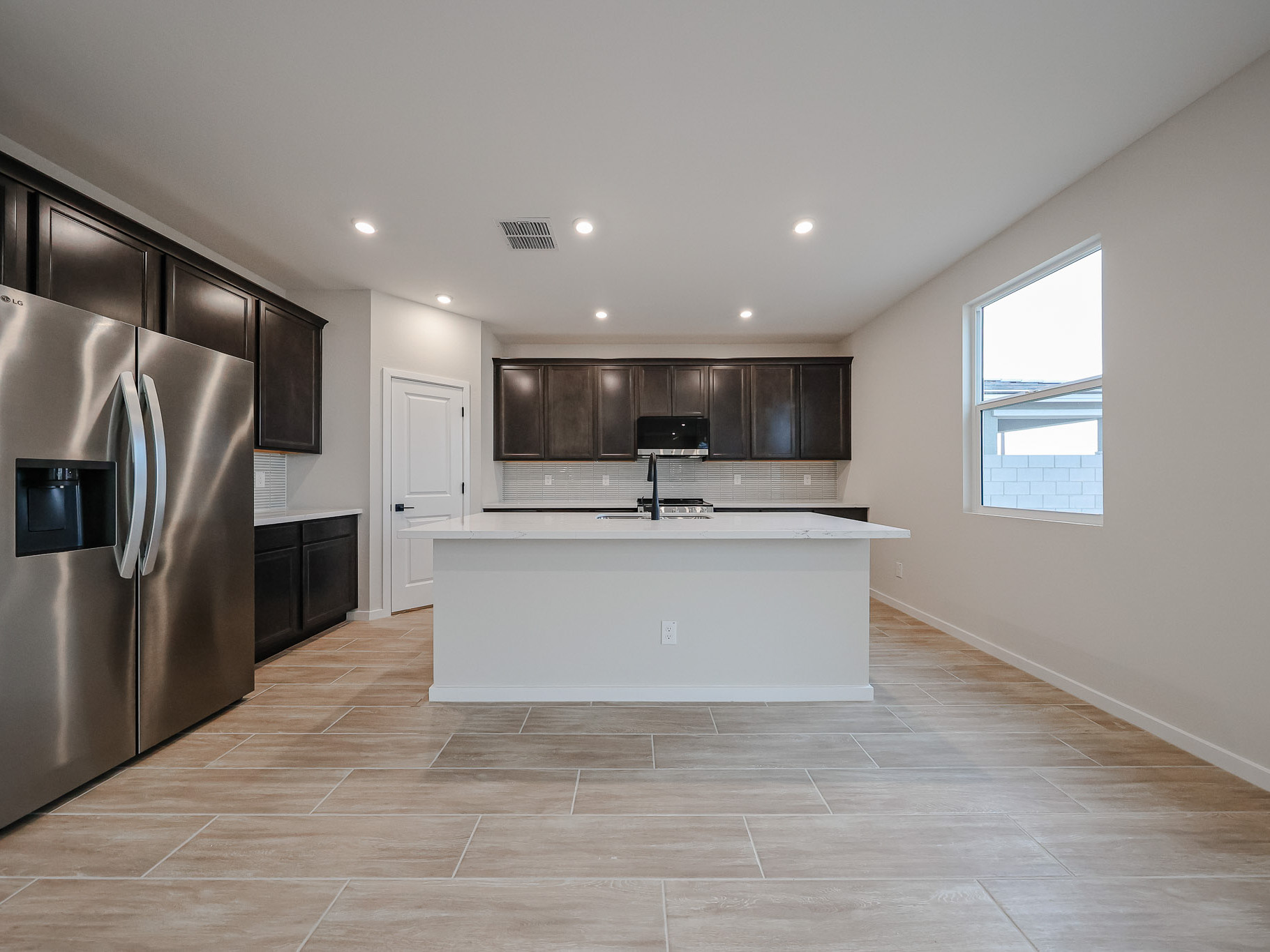 A kitchen with a large island.