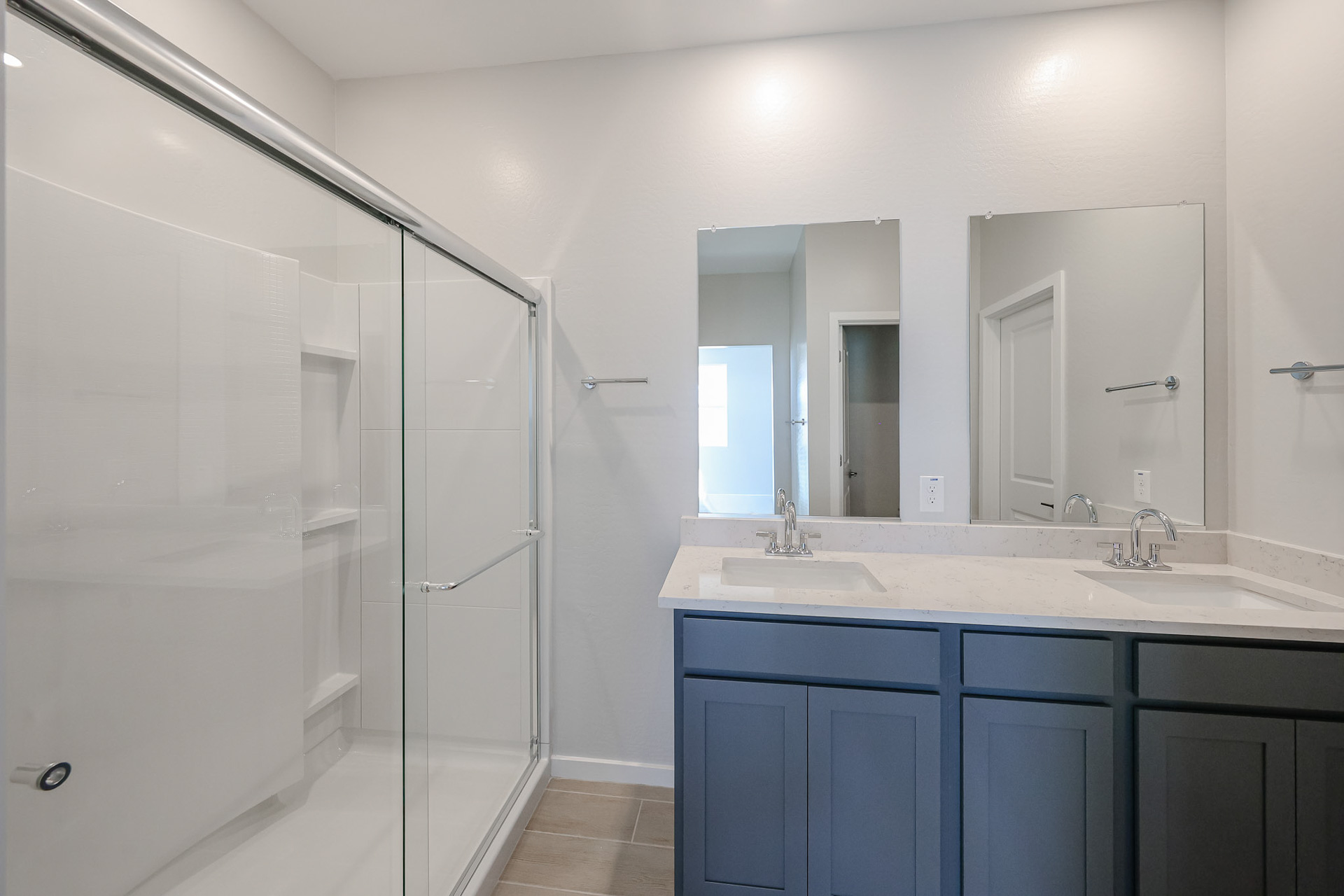 A bathroom with a glass shower.