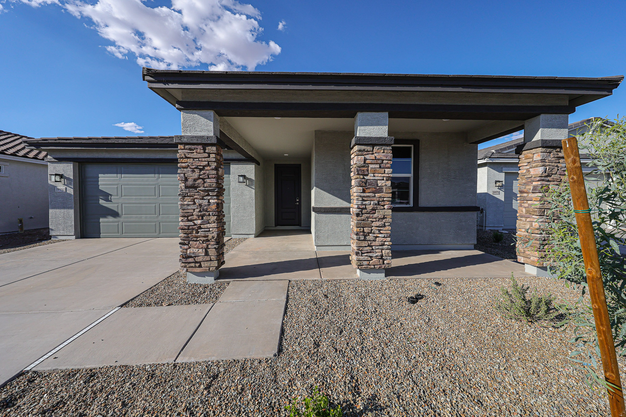 A house with a stone patio.