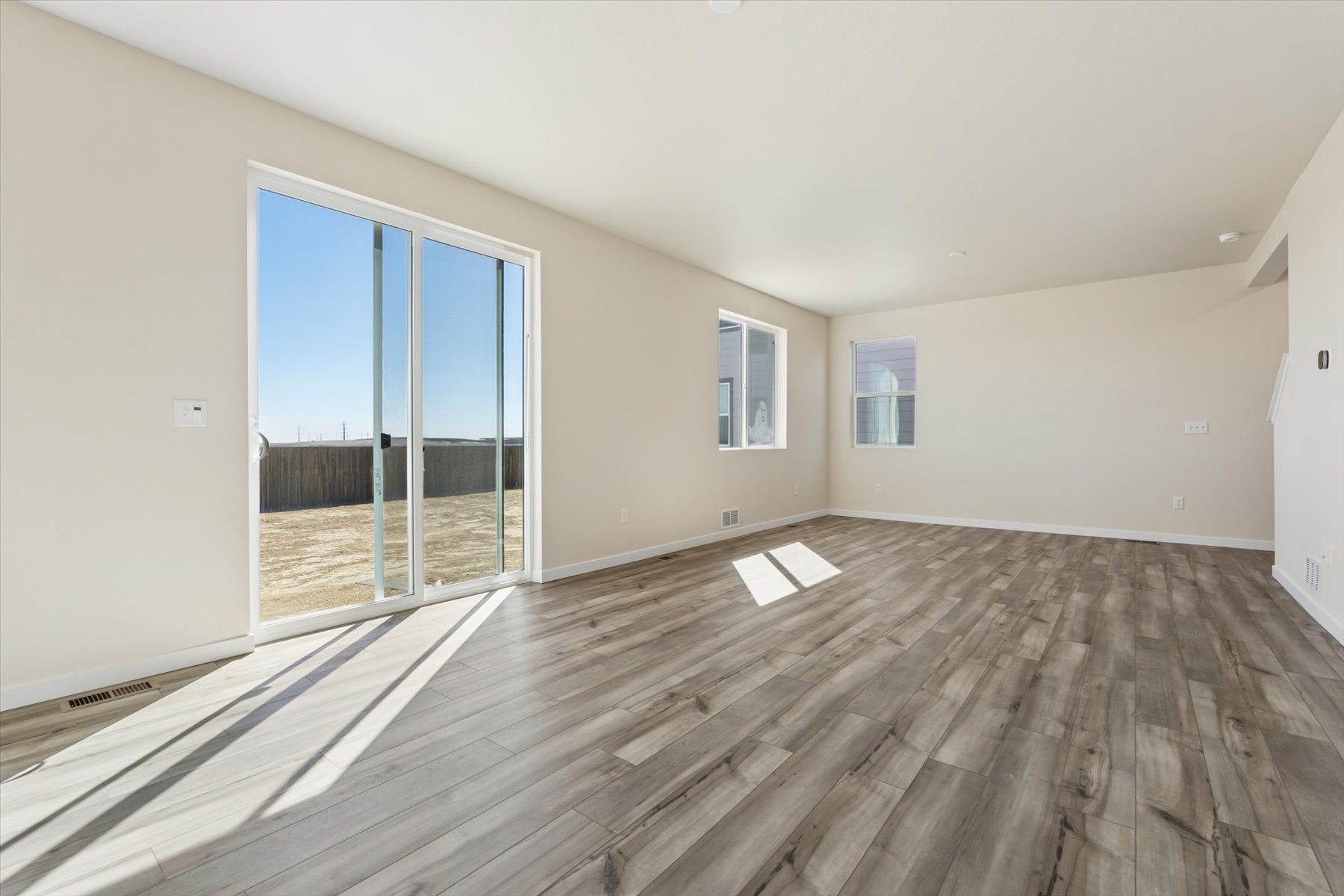 A room with a wood floor and a wood floor.