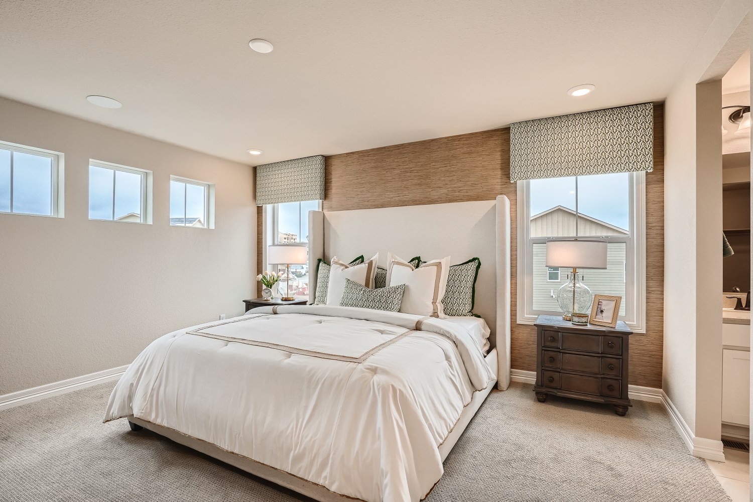 A bedroom with a large bed.