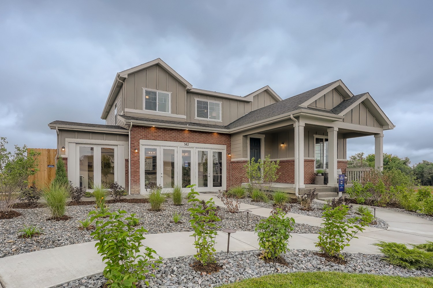 A house with a gravel driveway.