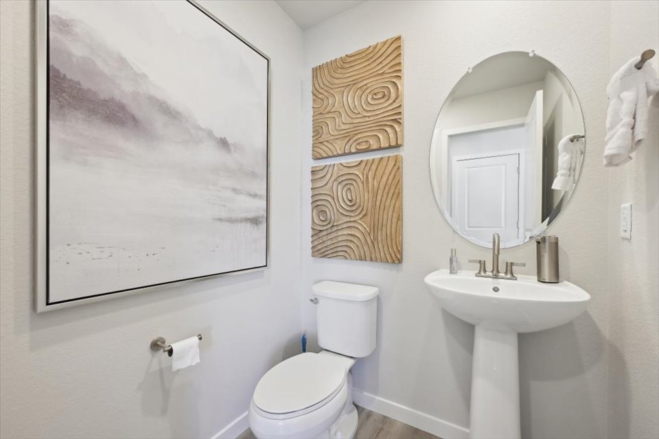 A bathroom with a sink and a toilet.
