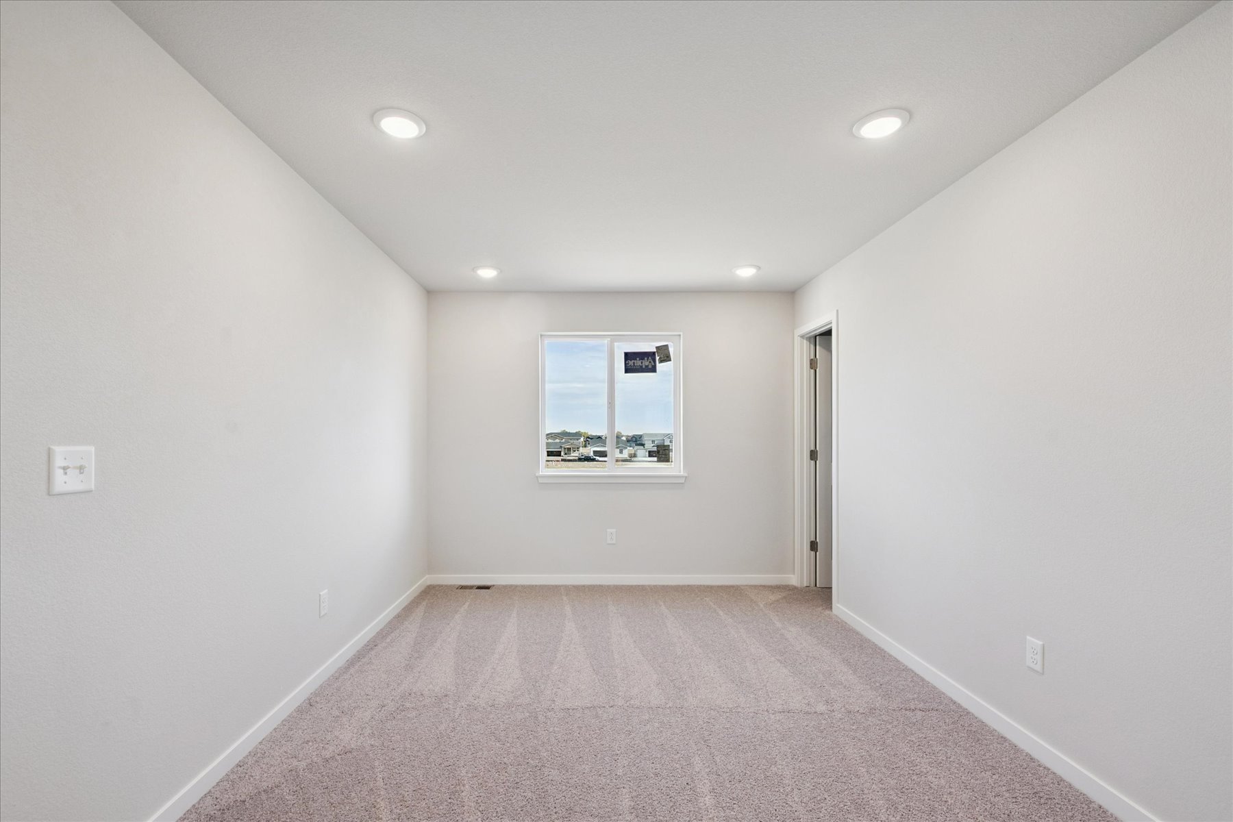 A hallway with a window.