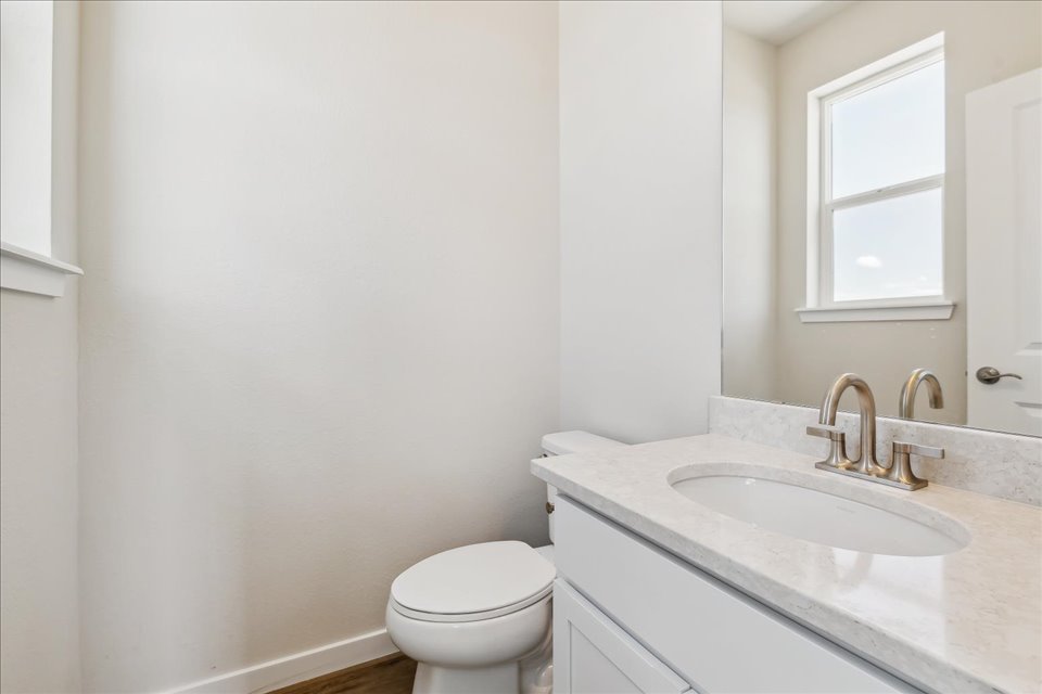 A bathroom with a sink and toilet.