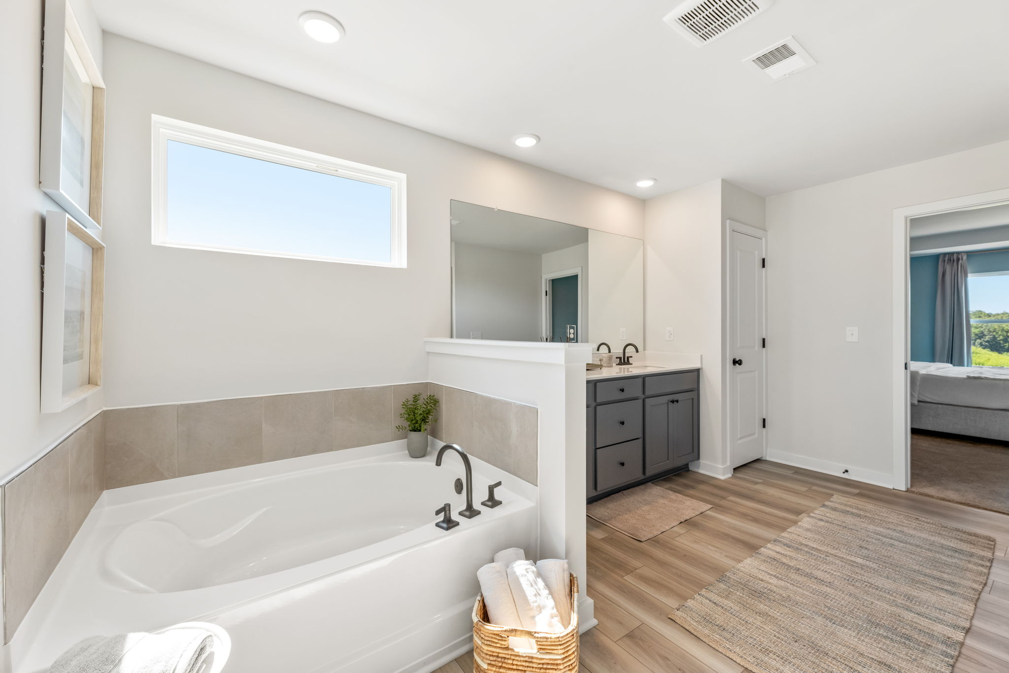 A bathroom with a tub and sink.