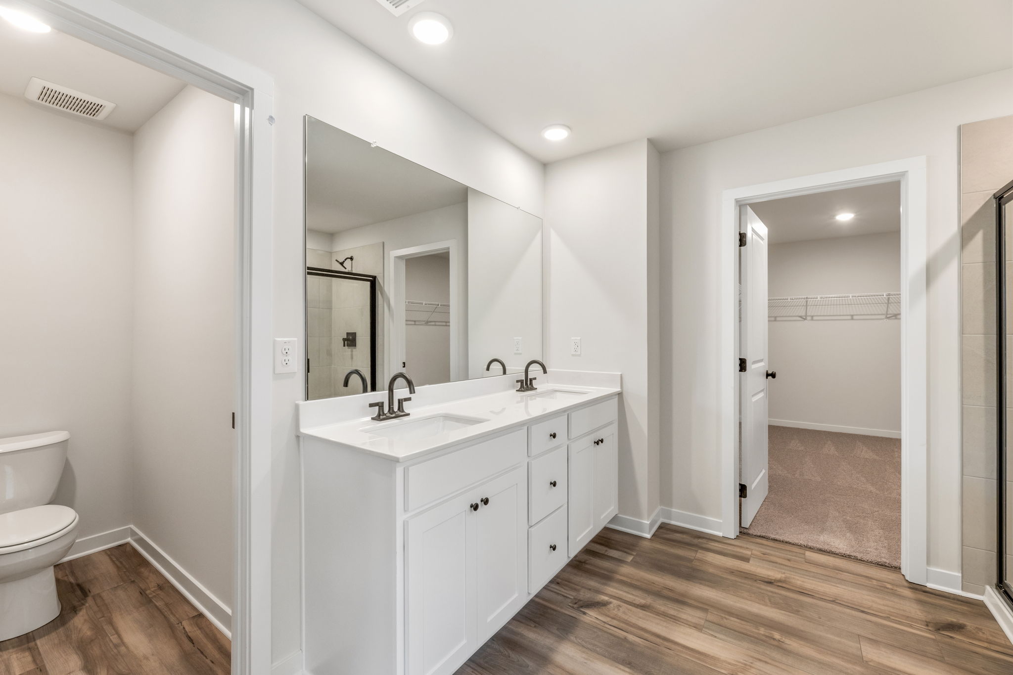 A bathroom with a sink and a toilet.