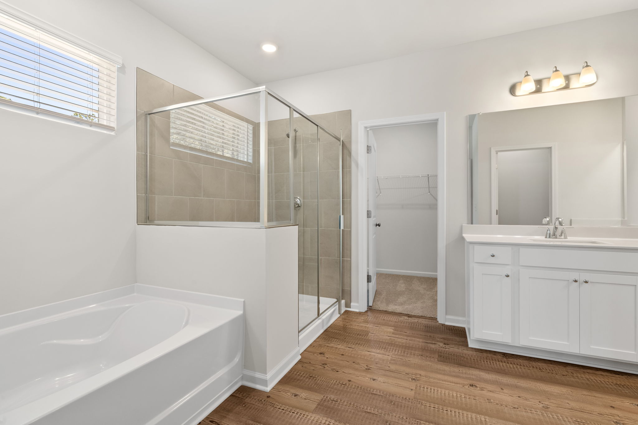 A bathroom with a glass shower.