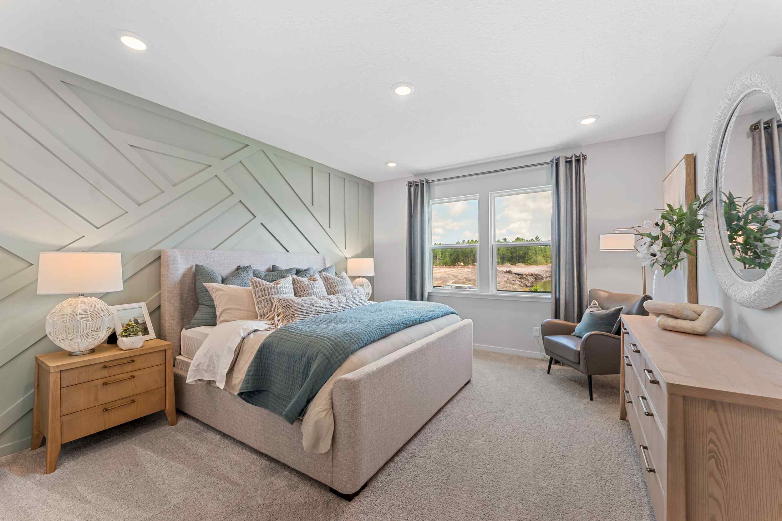 Laurel II Model Home Primary Bedroom with King Bed at Camden Woods in Kingsland, GA