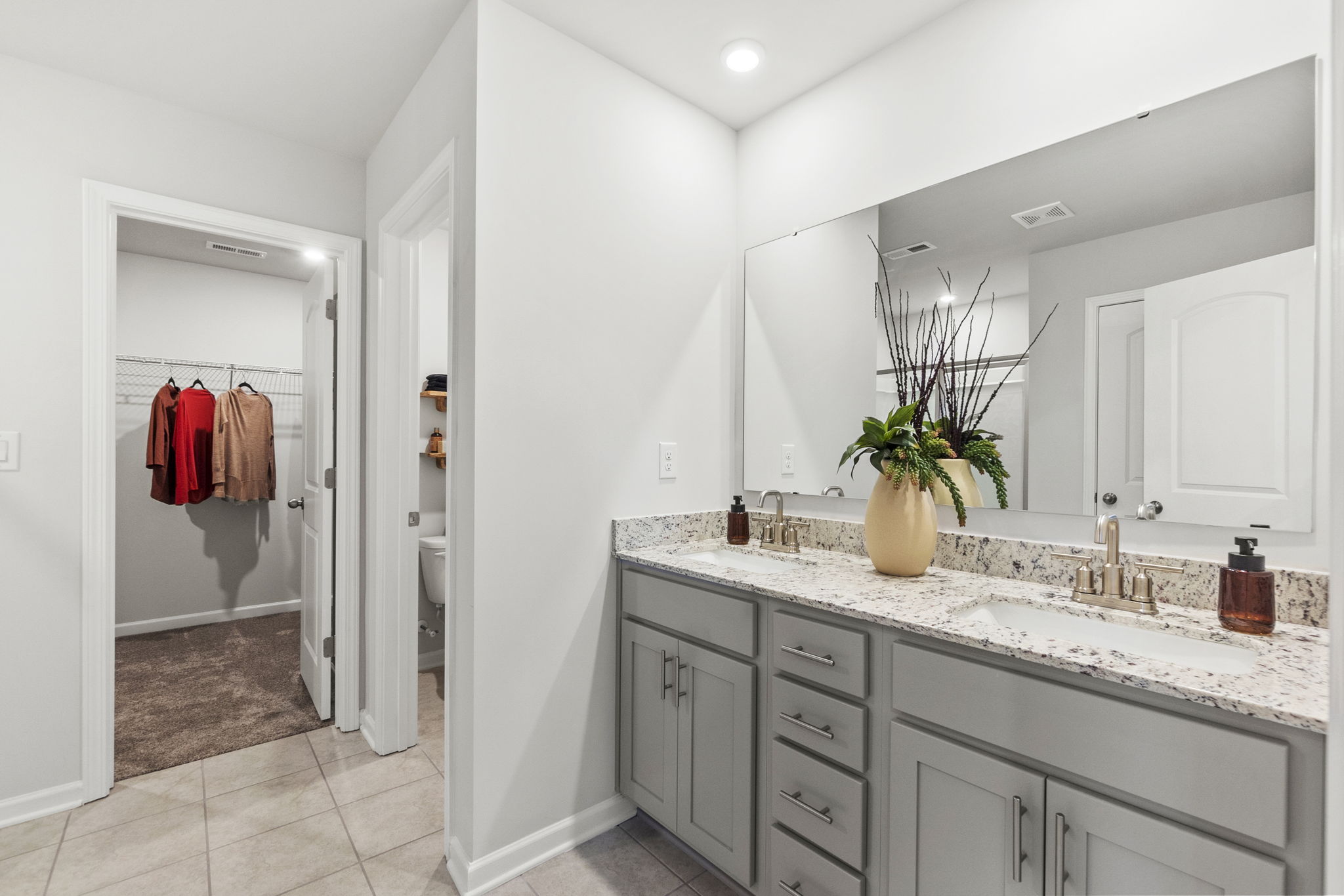 A bathroom with a sink and a shower.