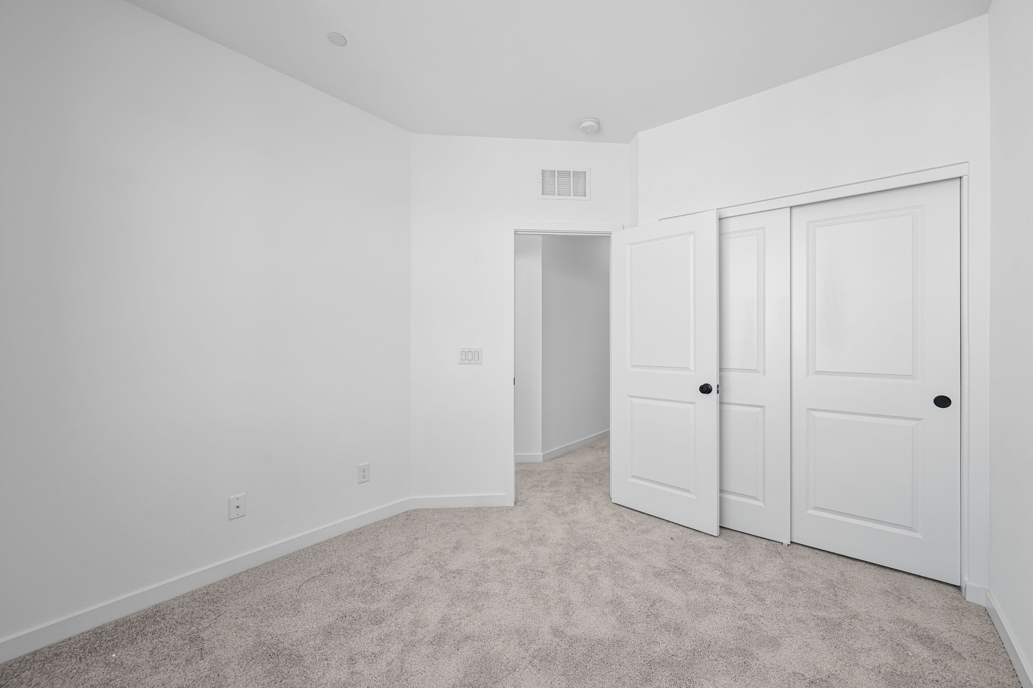 A room with white doors.