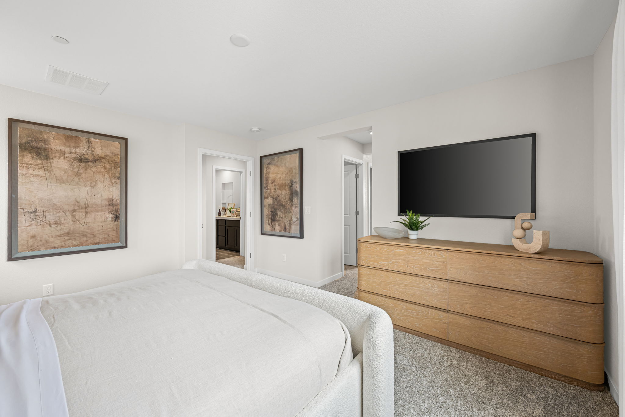 A bedroom with a tv and a bed.