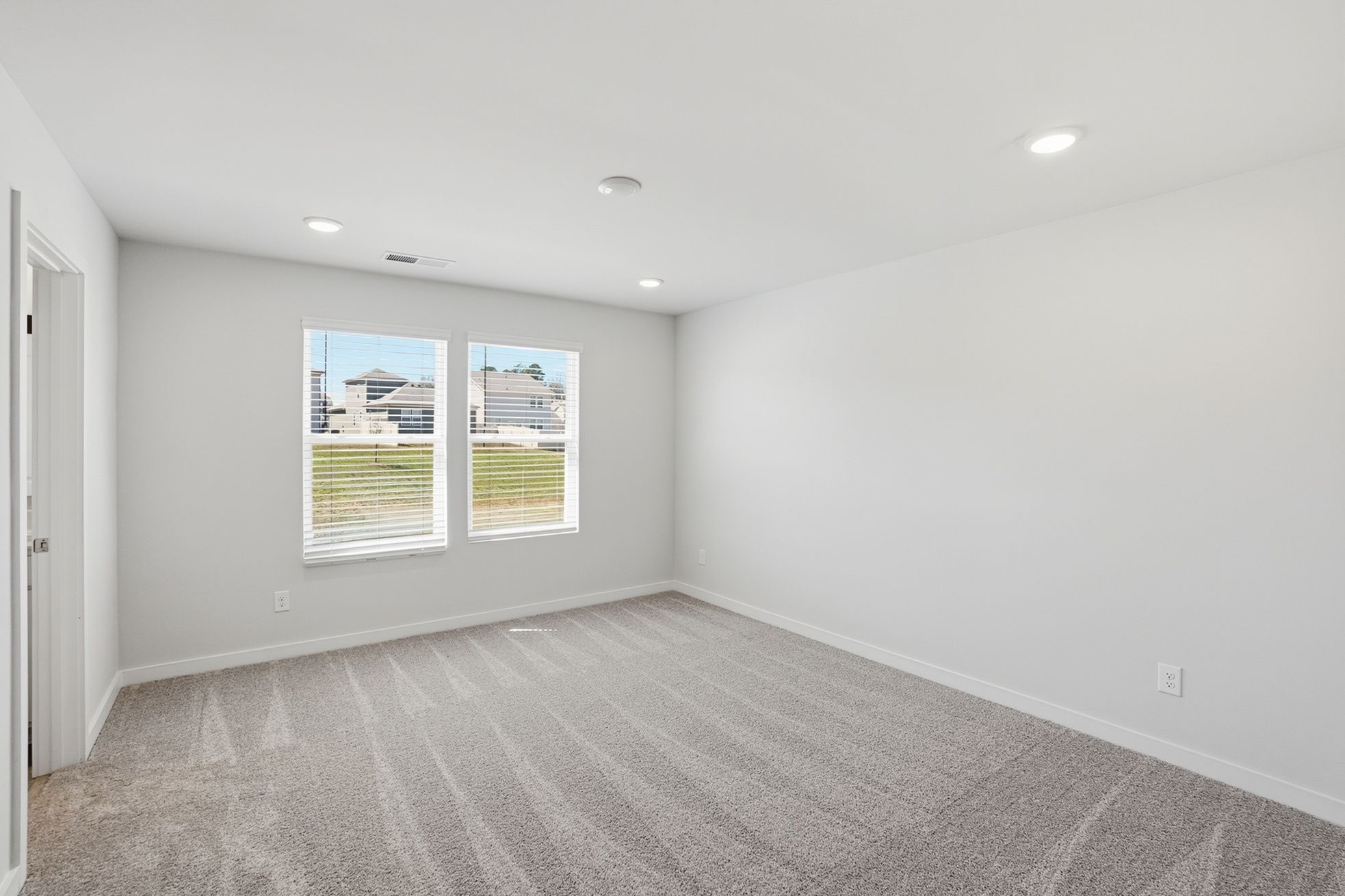 A room with a window and a door.