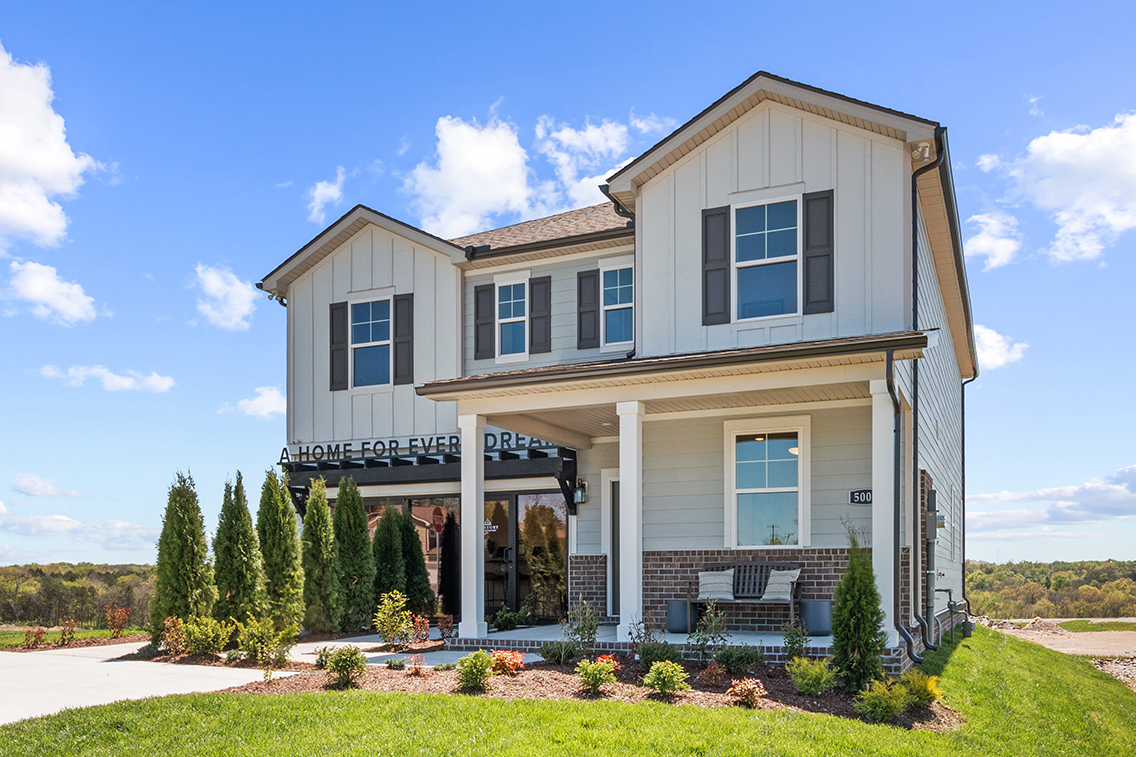 A house with a large front yard.