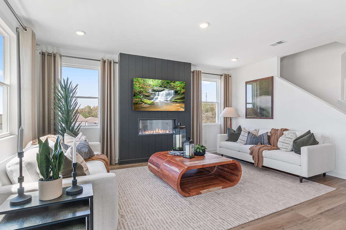 A living room with a fireplace.
