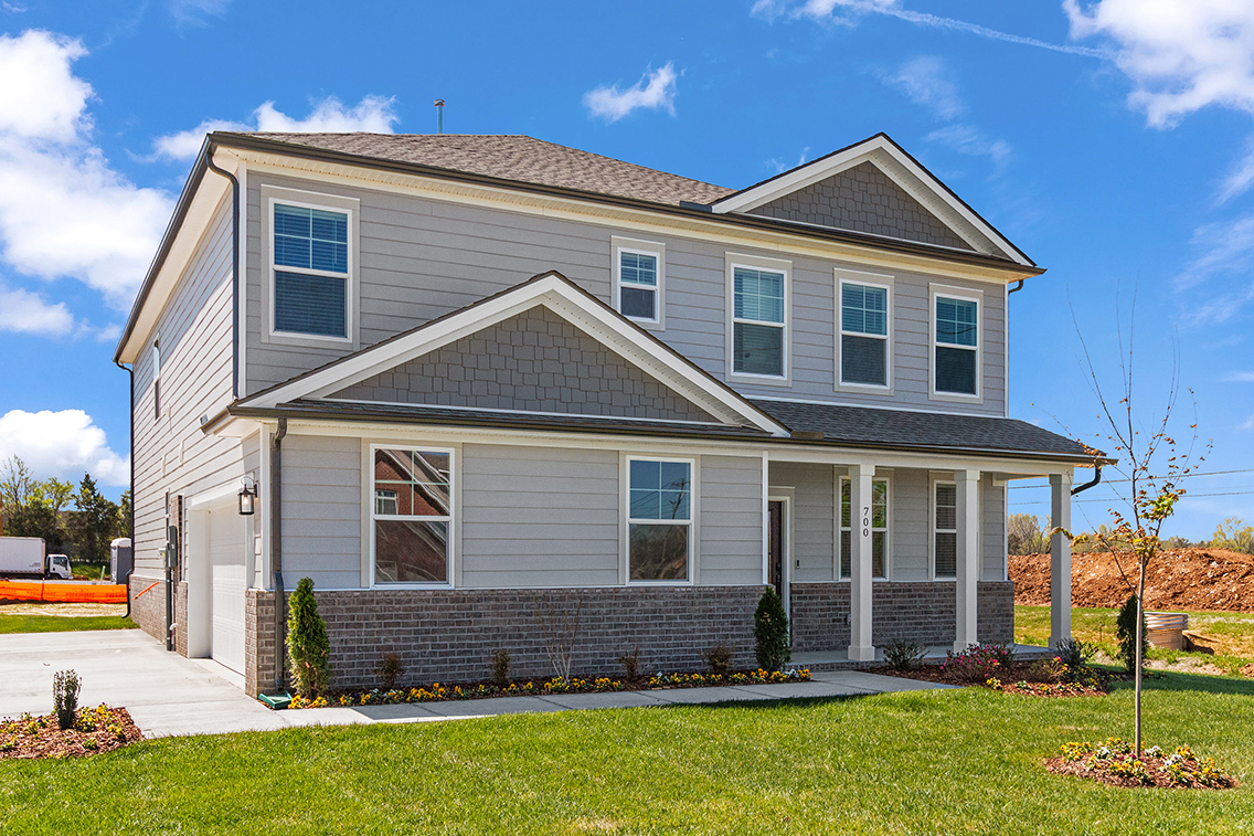 A house with a brick driveway.