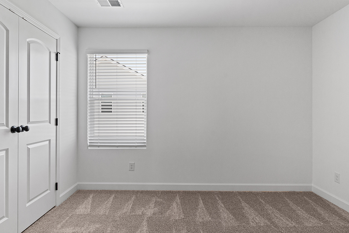 A room with a door and a window.