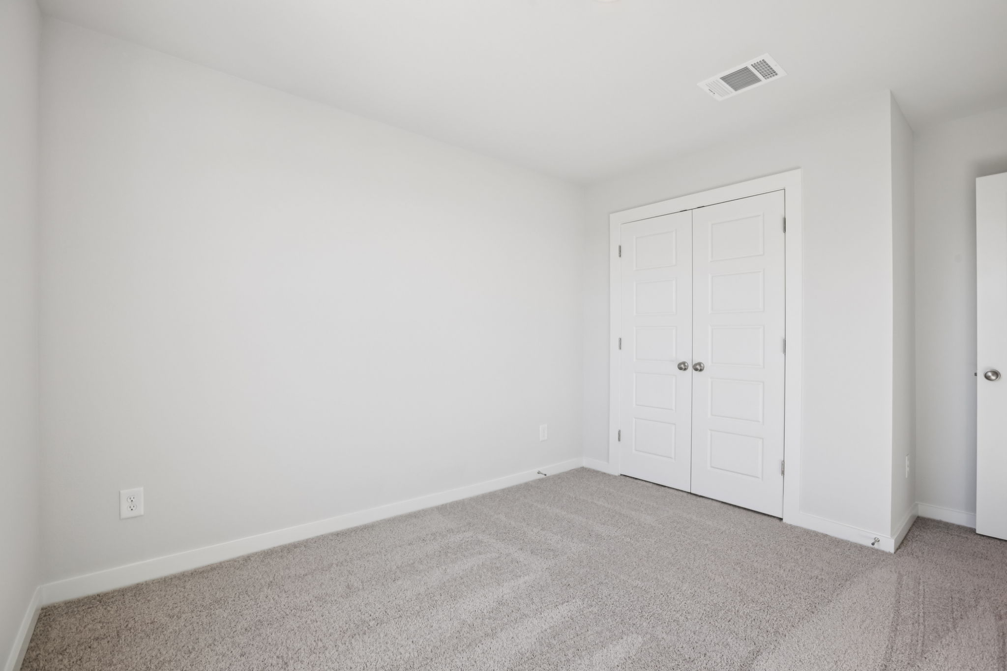 A room with white doors.