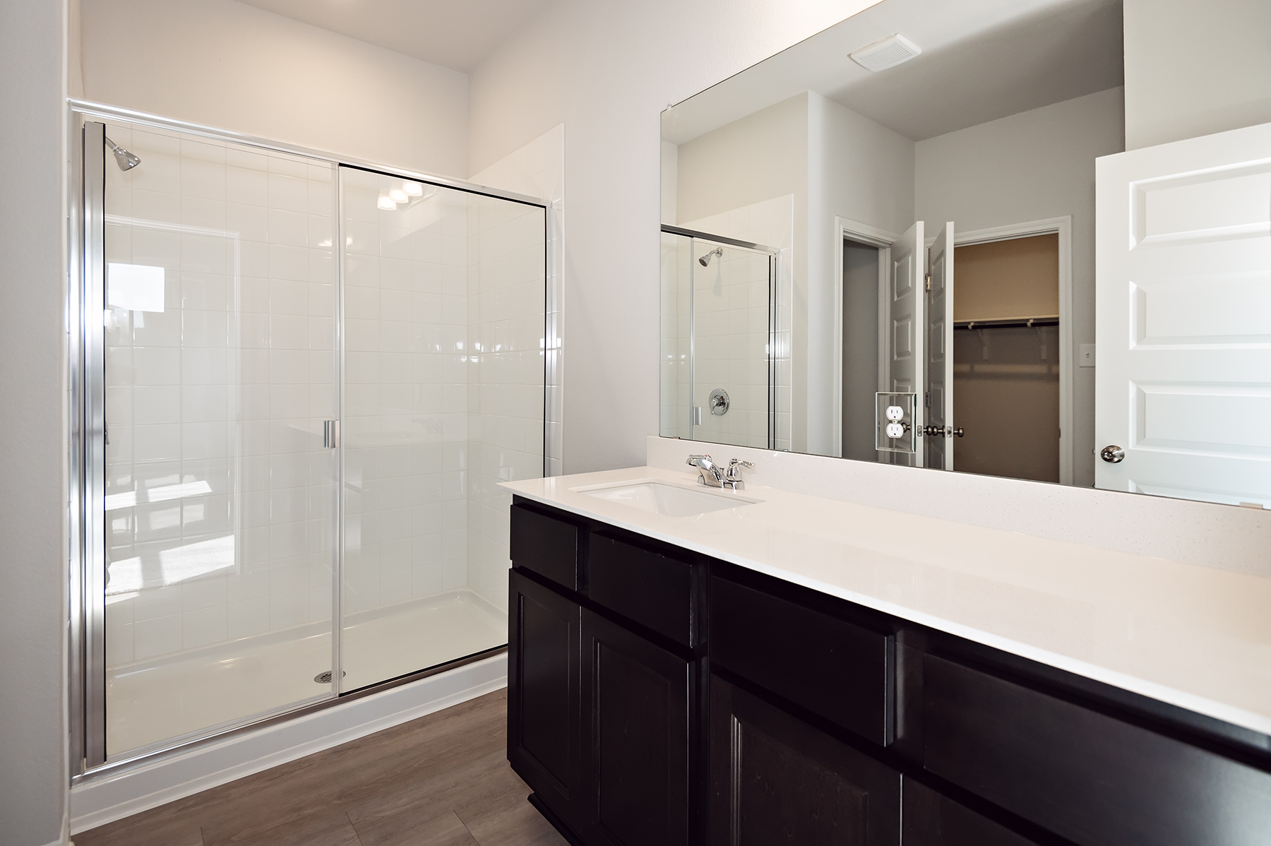 A bathroom with a glass shower.
