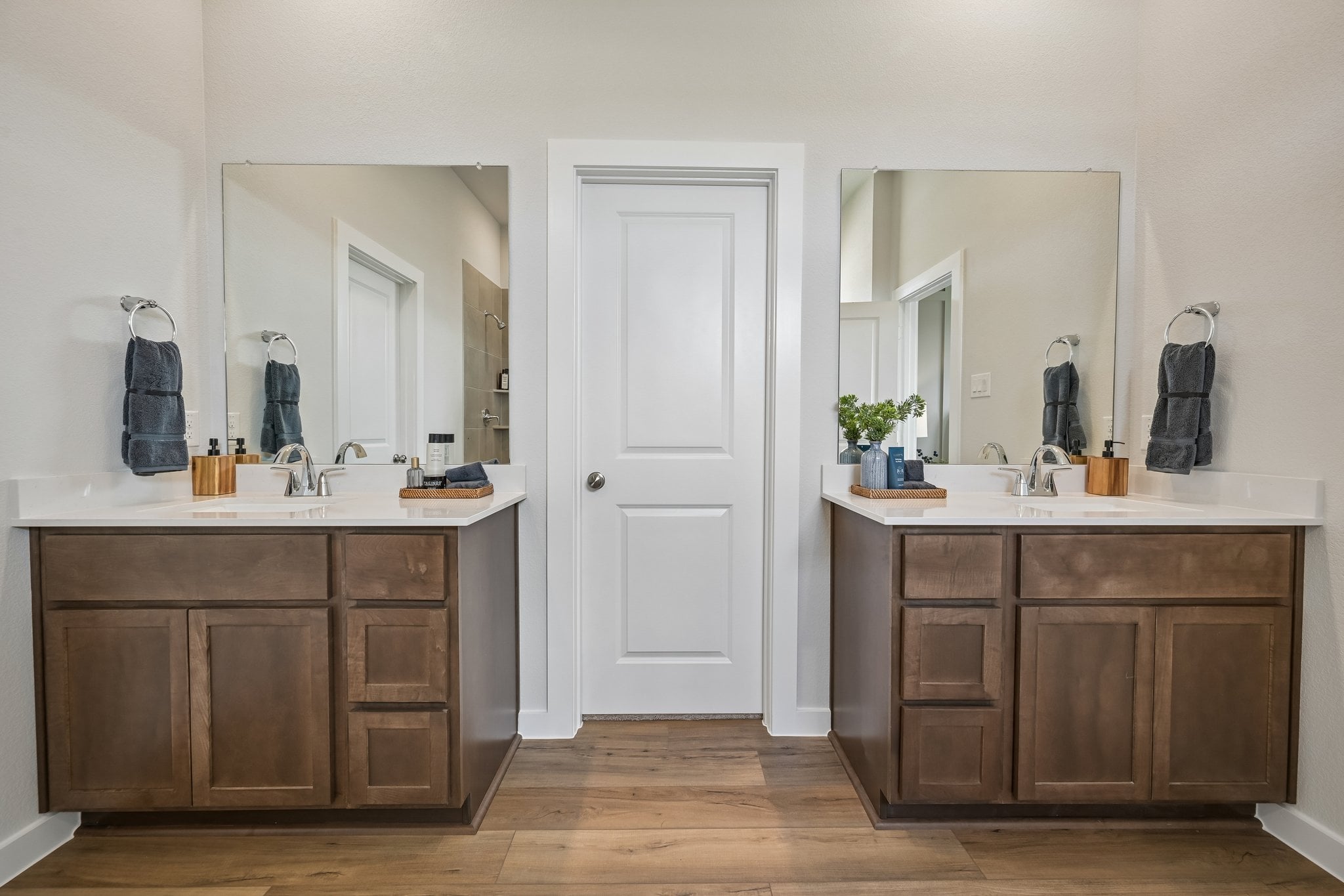 A bathroom with a wood floor.