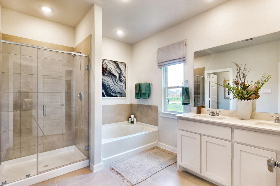 A bathroom with a glass shower.