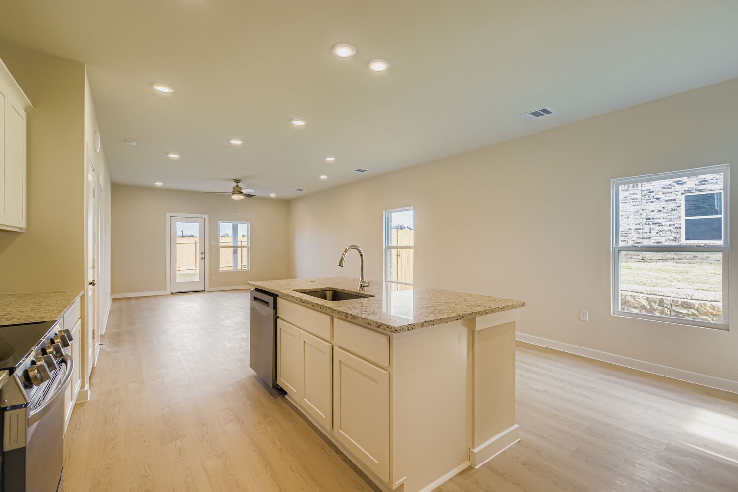 A kitchen with a marble countertop.