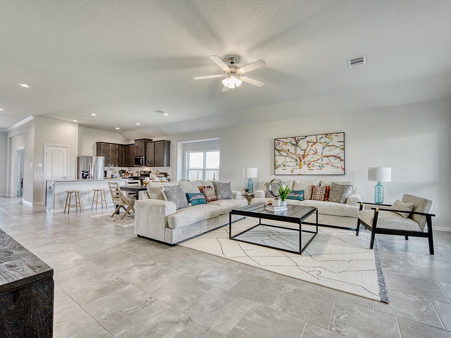 A living room with a tile floor.