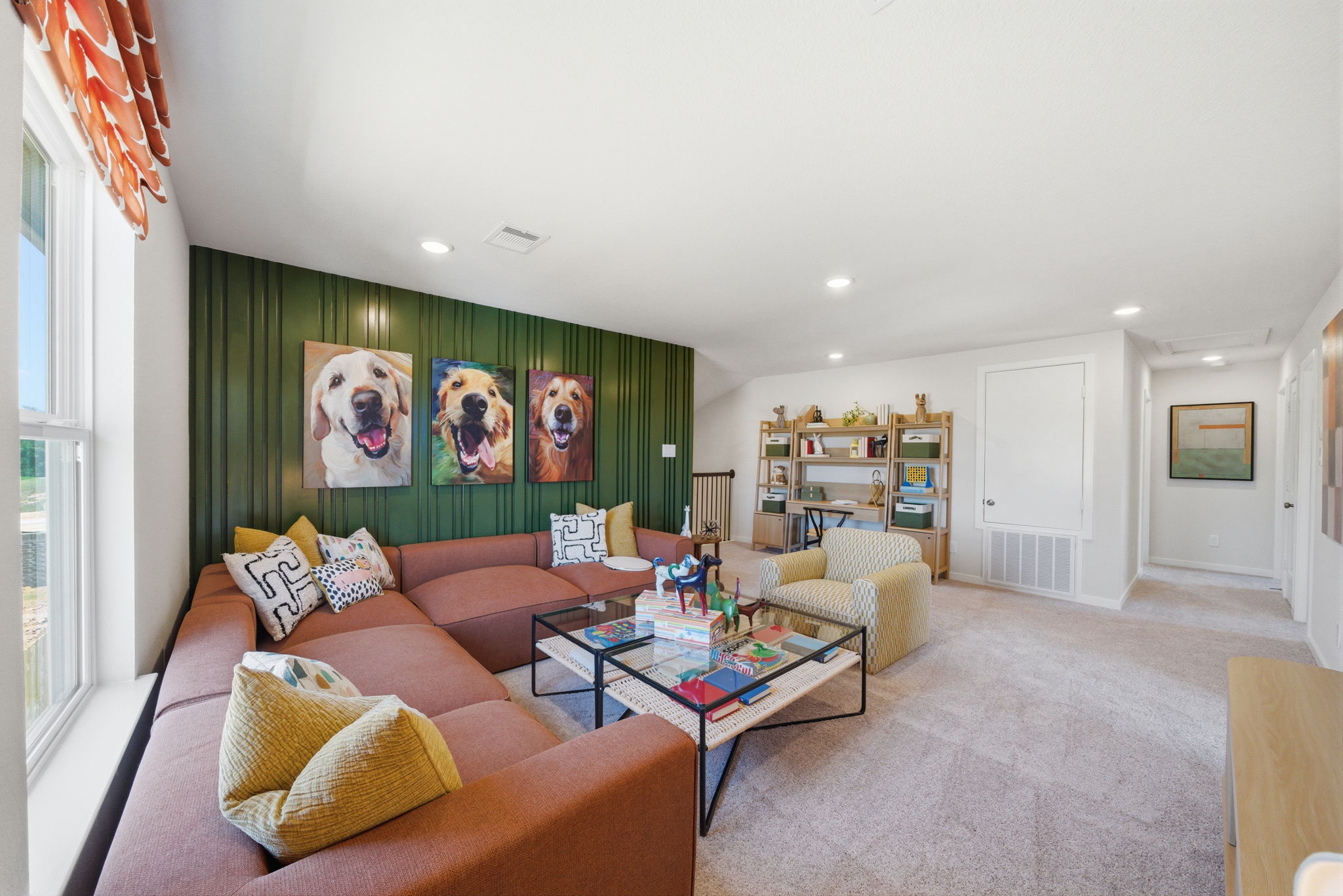 A living room with a green wall.