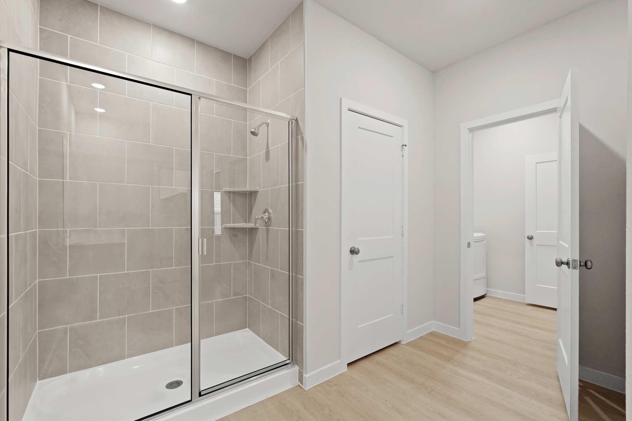 A bathroom with a glass shower.