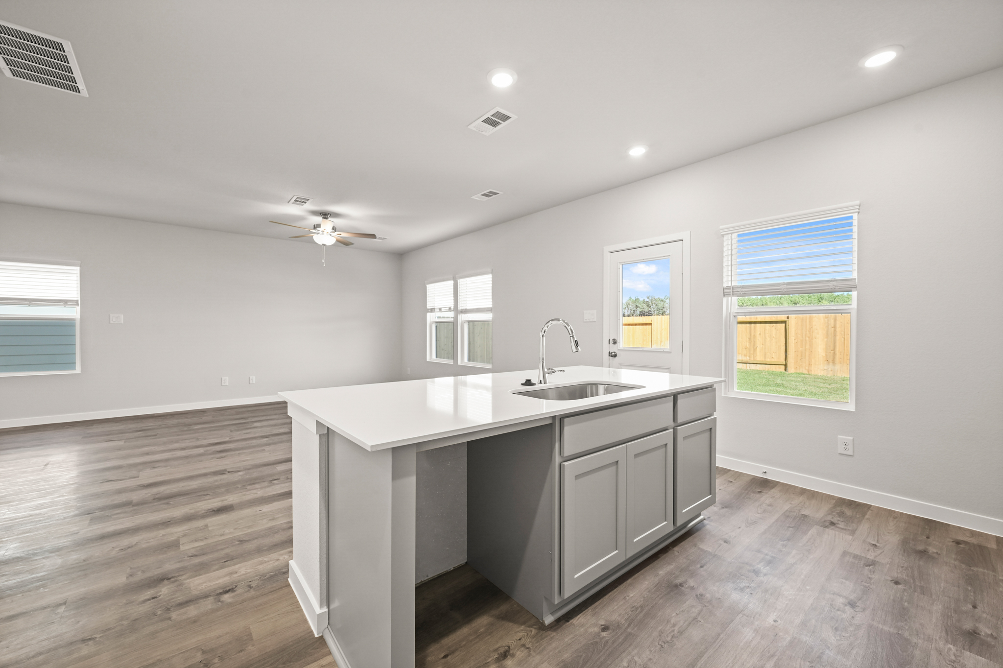 A kitchen with a sink and a window.