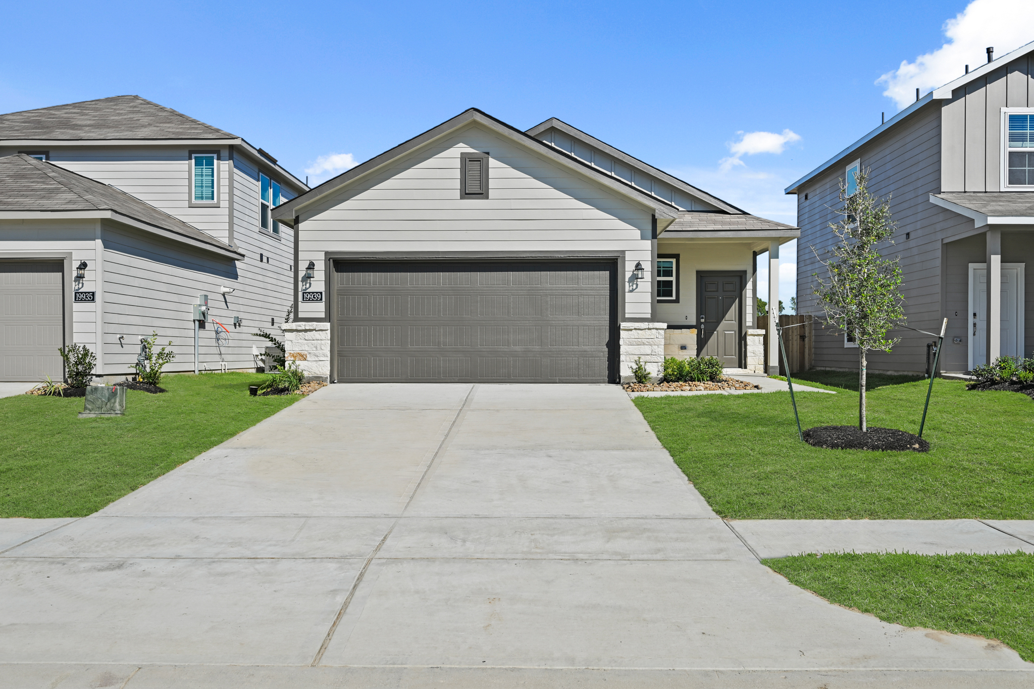 A driveway leading to a house.