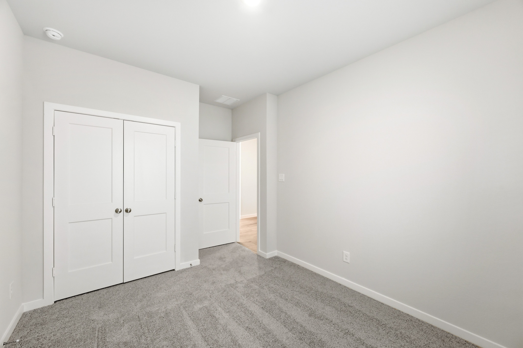 A room with white doors.
