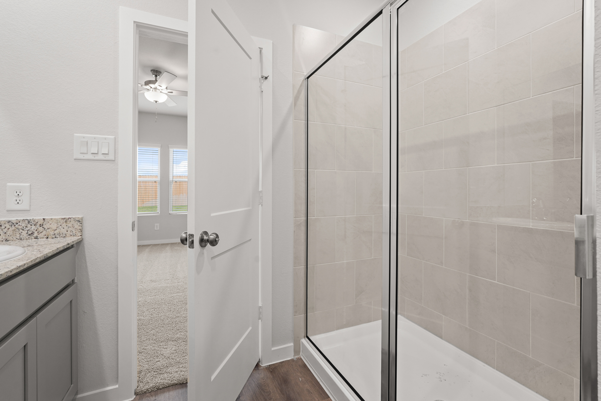 A bathroom with a glass shower.