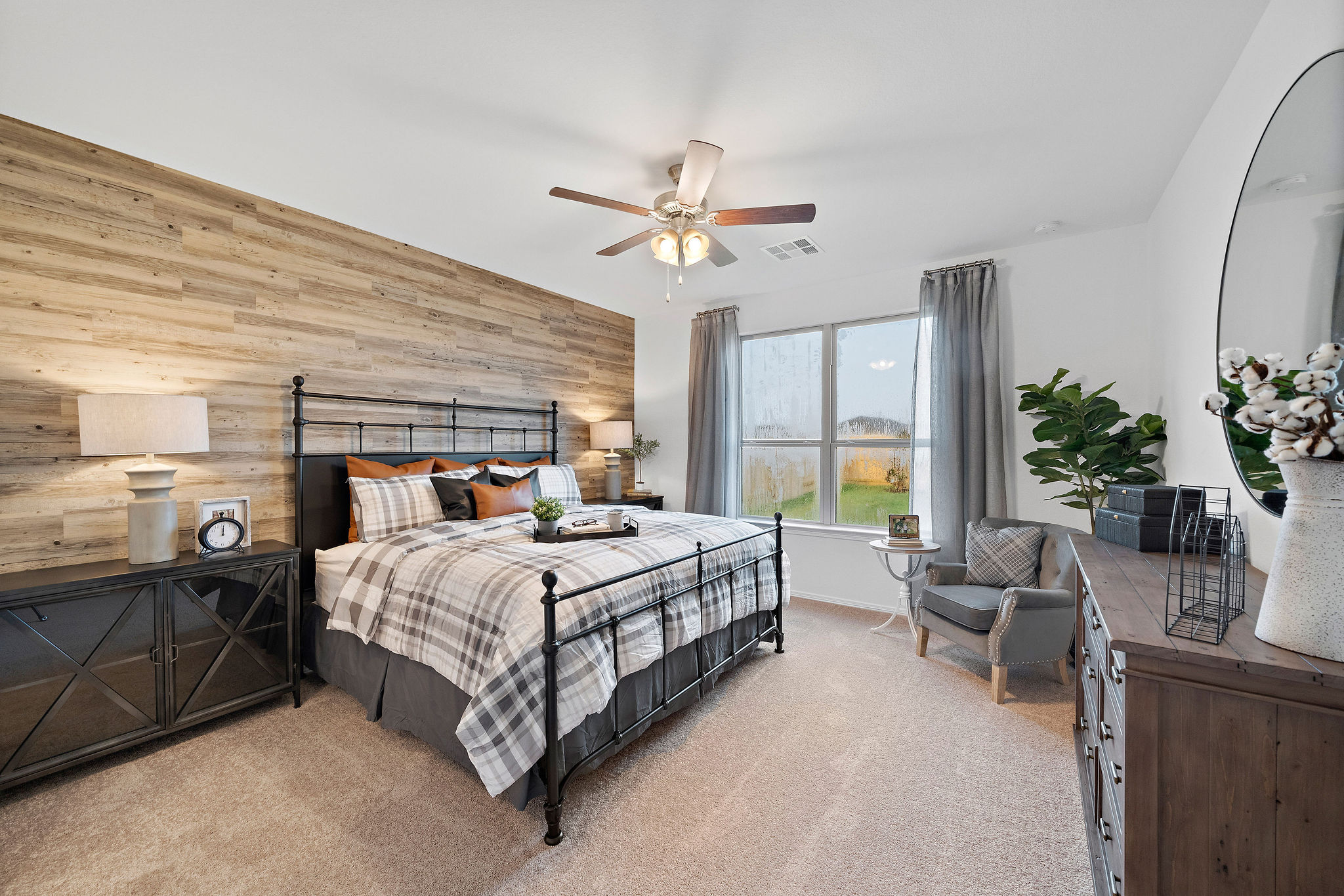 A bedroom with a large bed.