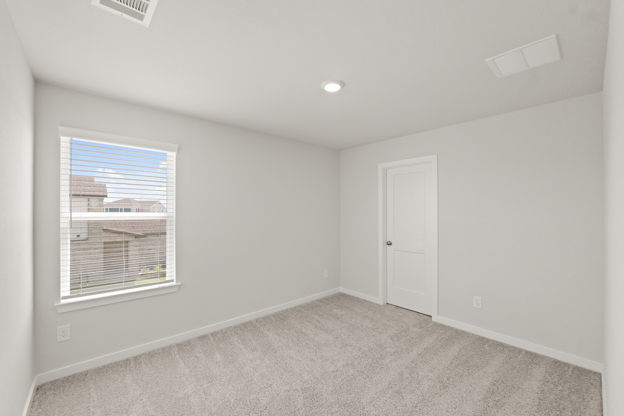 A room with a door and a window.