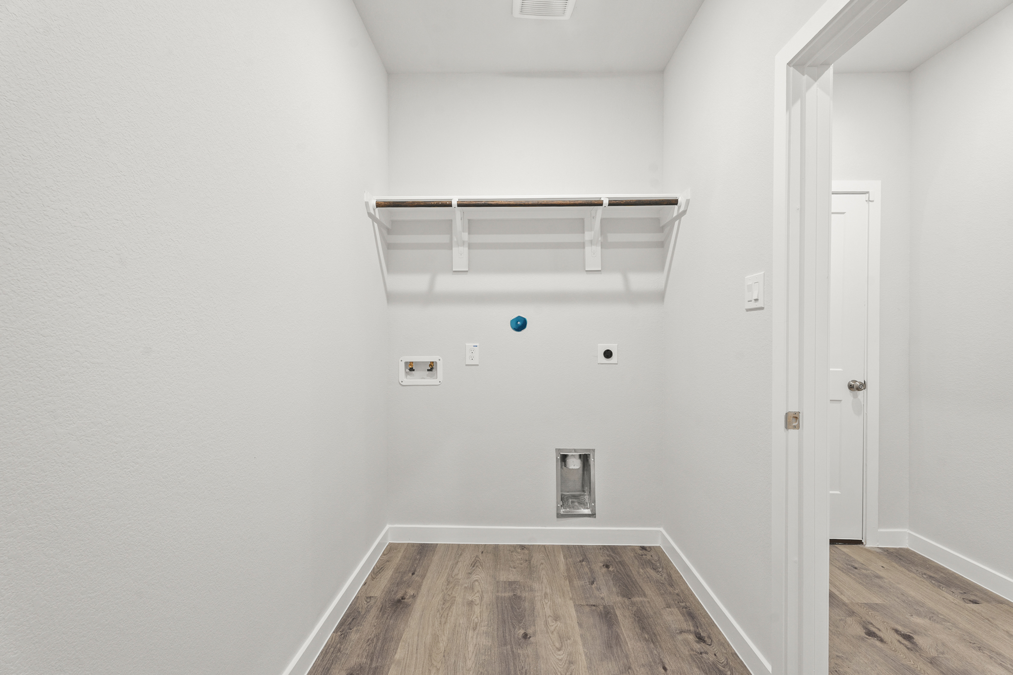 A room with a table and a door.