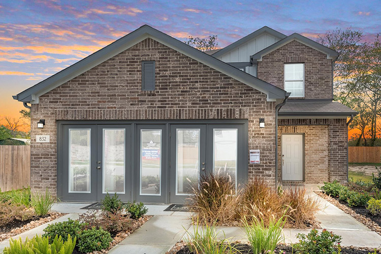 A brick building with a driveway.