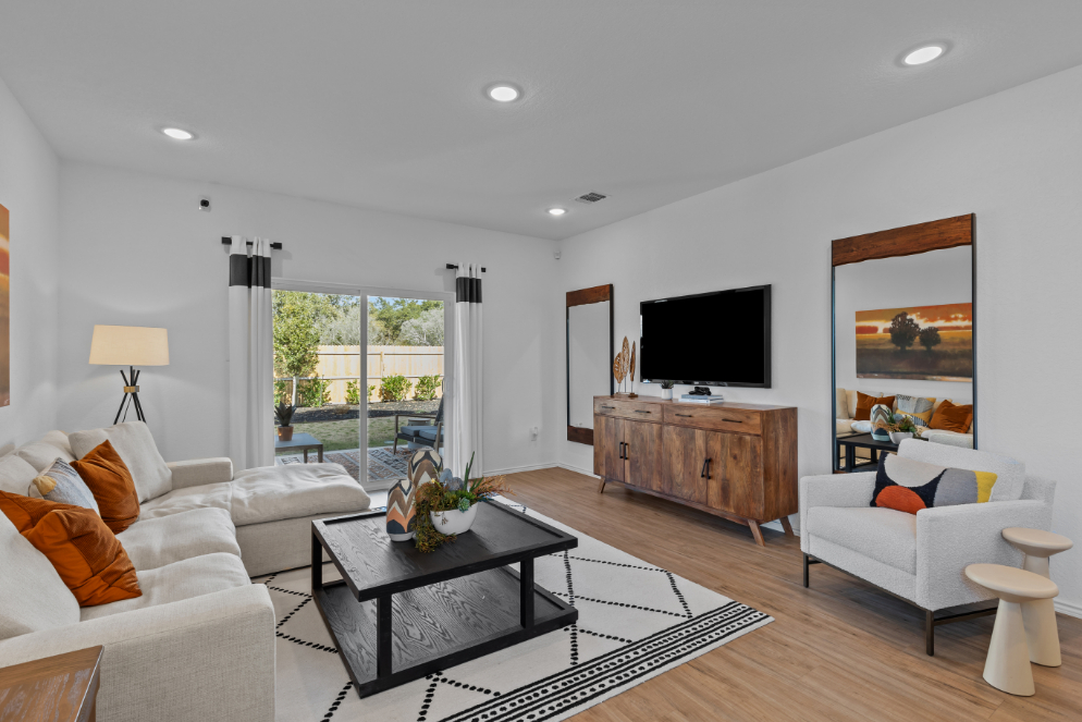 A living room with a tv and couches.