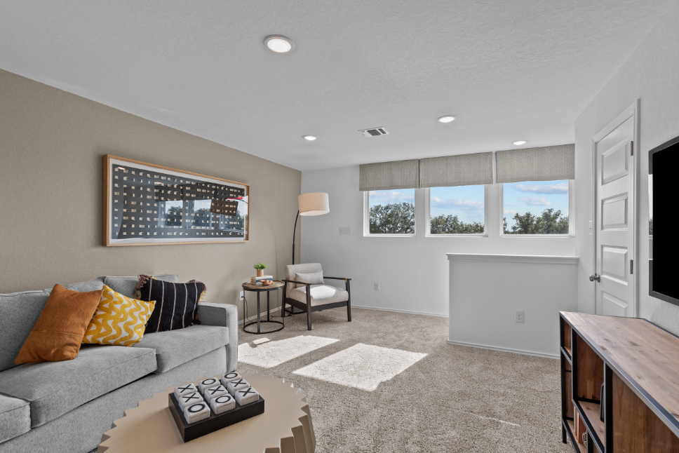 A living room with a couch and a table.