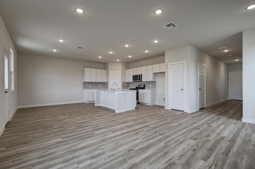 A large kitchen with white cabinets.